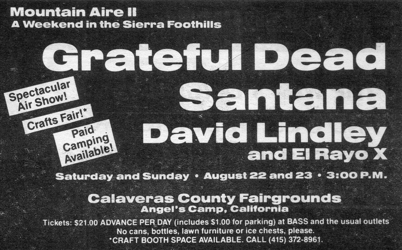 A black and white newspaper advertisement reading Mountain Aire II, A Weekend in the Sierra Foothills, with Grateful Dead, Santana, David Lindley and El Rayo X. Tilted callout boxes advertise a Spectacular Air Show, Crafts Fair and Paid Camping. Tickets twenty-one dollars advance per day.